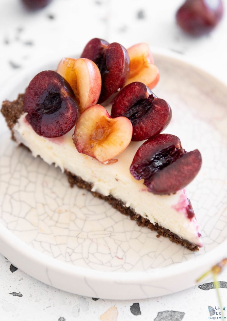 slice of Cherry Pistachio Cheesecake | Milk and Cardamom