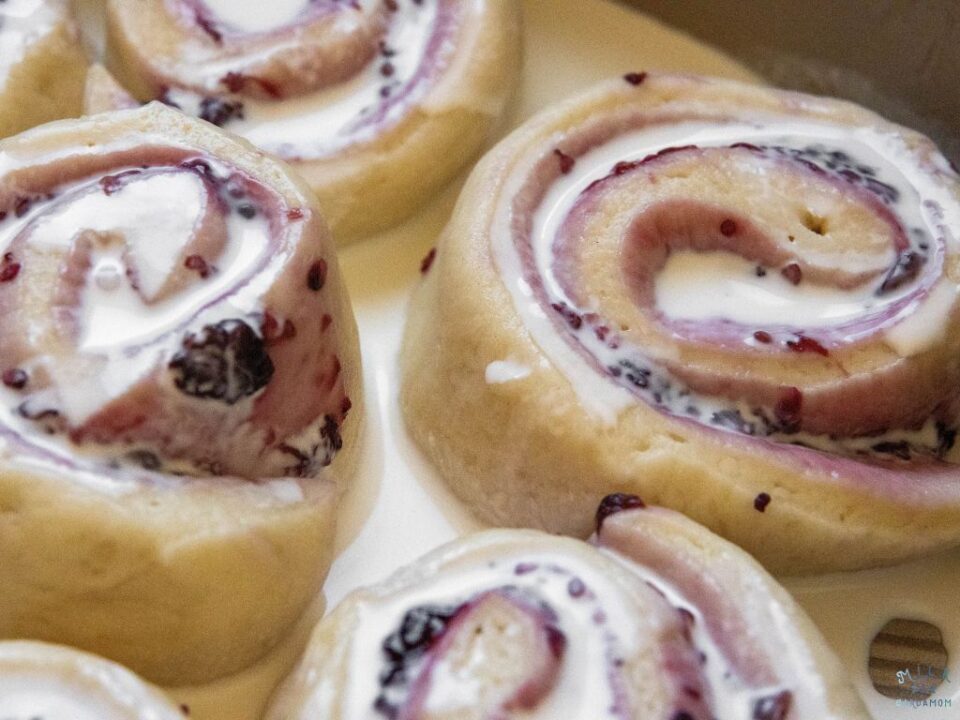Mulberry Sweet Rolls with heavy cream drizzled on top